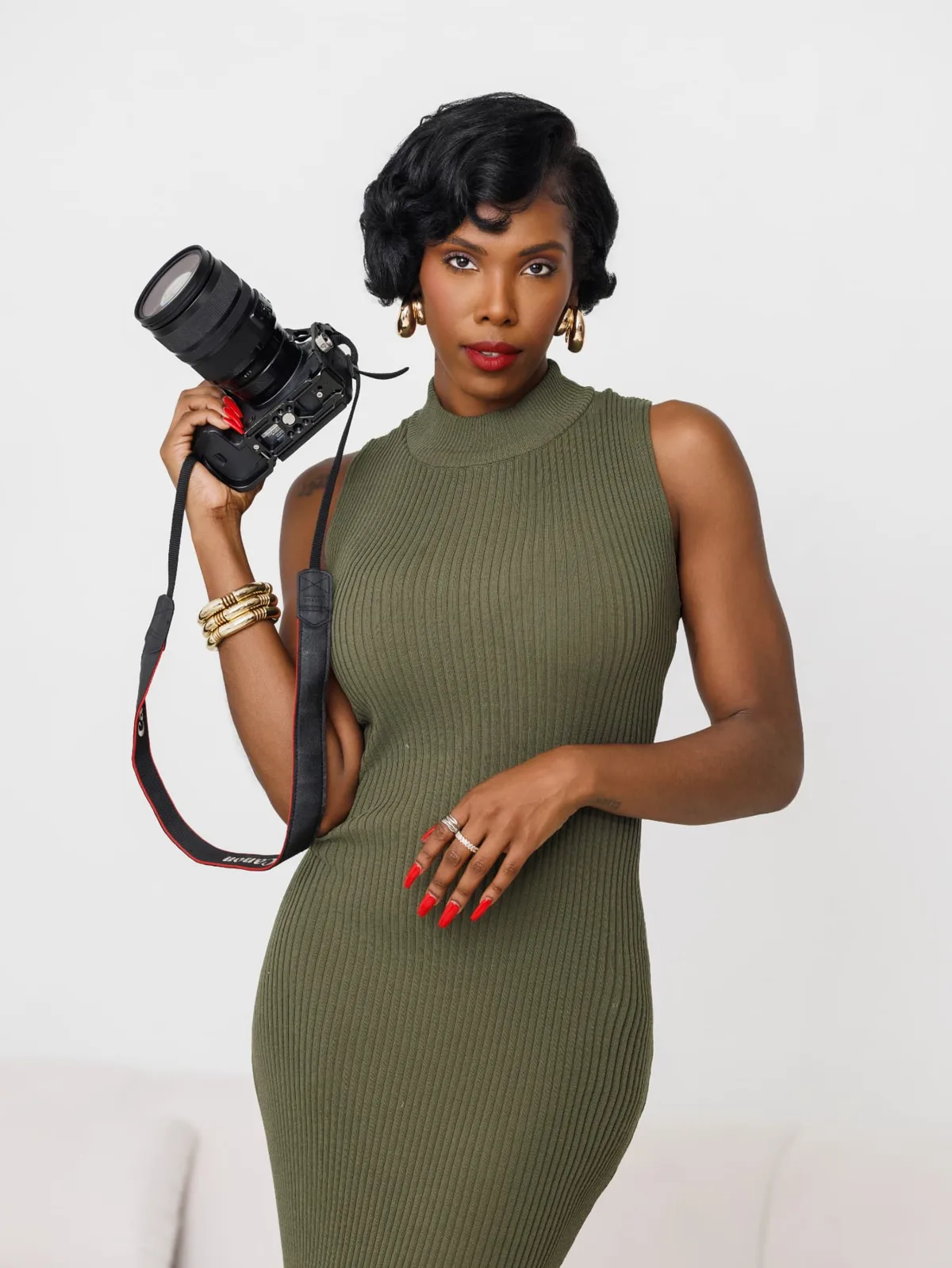 Portrait of Jasmine “JLavii” Hutcherson holding her camera