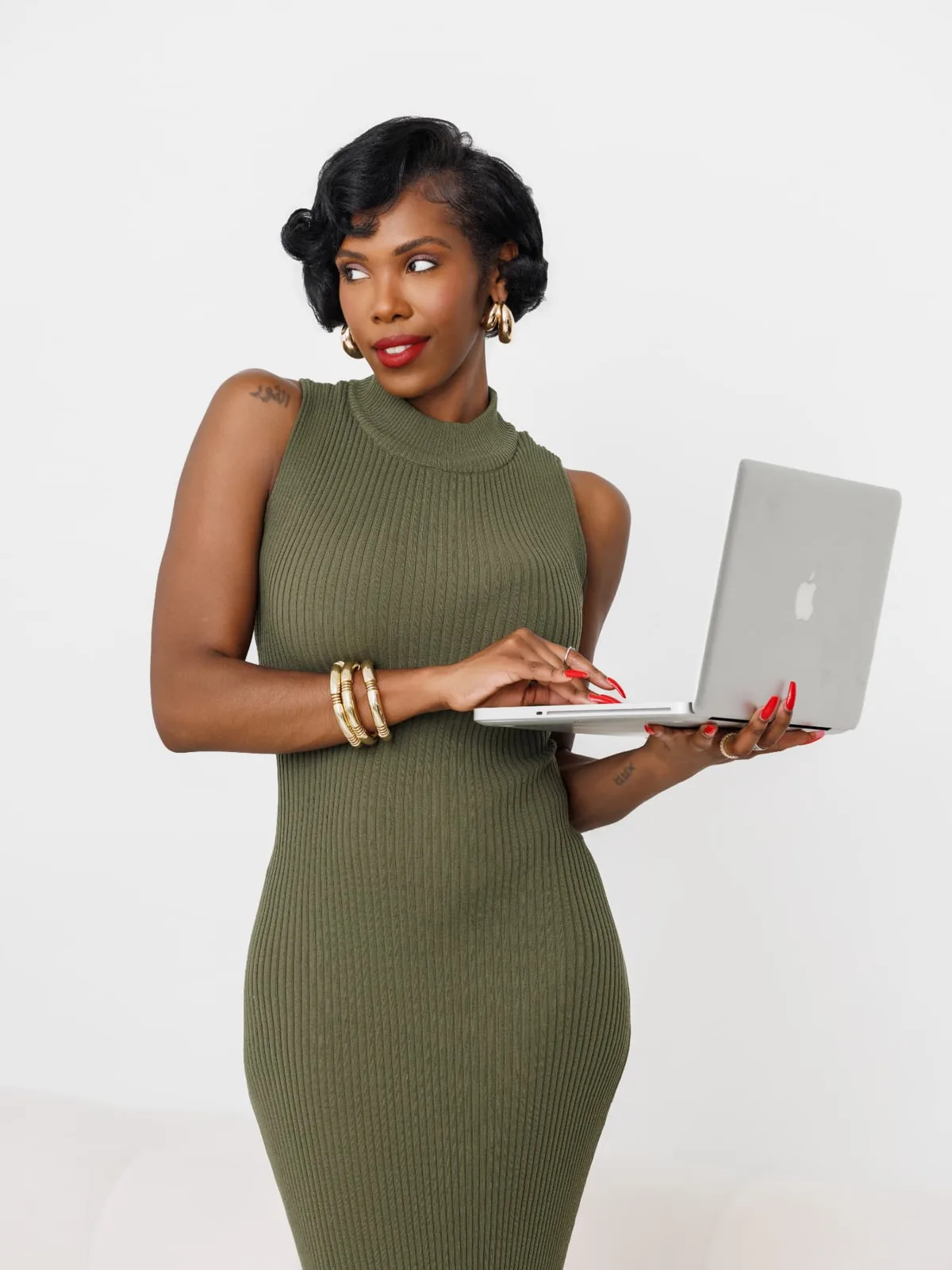 Jasmine reviewing work on a laptop